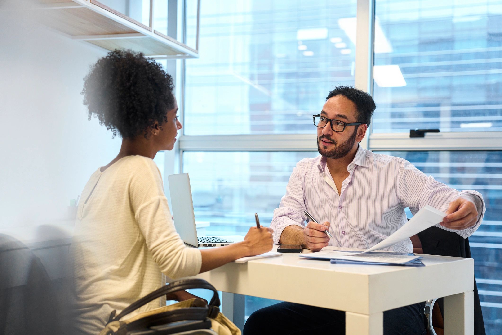 Advisor discussing mortgage paperwork with a client